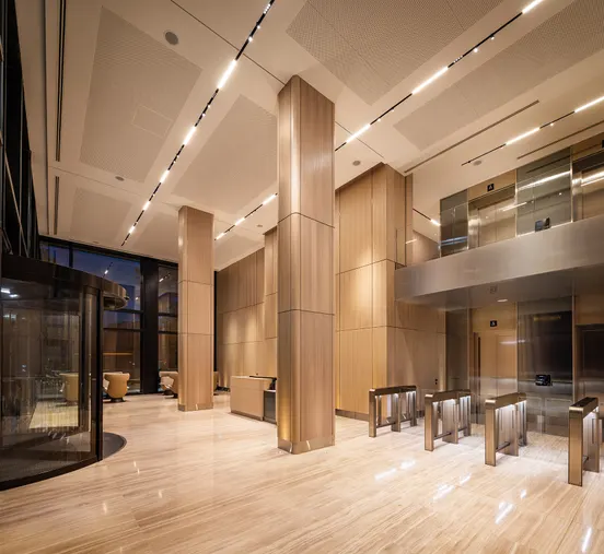 Timber-clad lobby interior of a Vanp Invest development